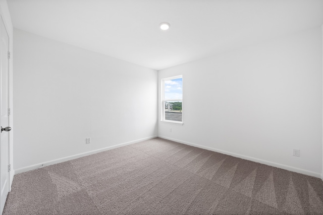 spare room featuring carpet flooring