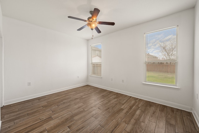 unfurnished room featuring ceiling fan and dark hardwood / wood-style floors