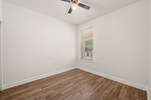 empty room featuring ceiling fan and wood-type flooring