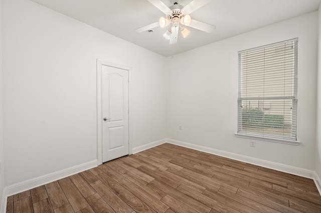 unfurnished room featuring hardwood / wood-style floors and ceiling fan