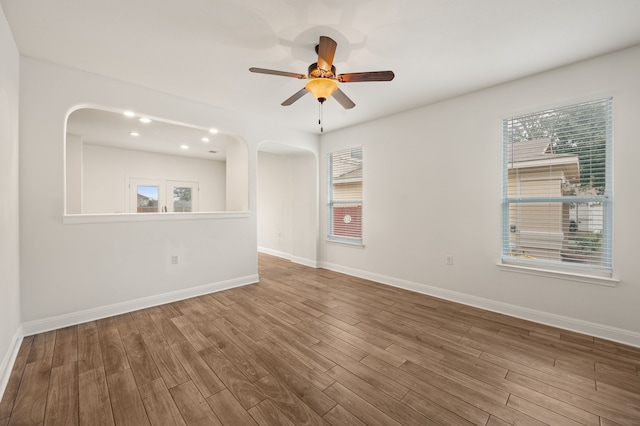 unfurnished room featuring hardwood / wood-style flooring and ceiling fan