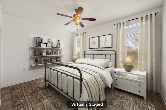 bedroom with ceiling fan and dark hardwood / wood-style floors