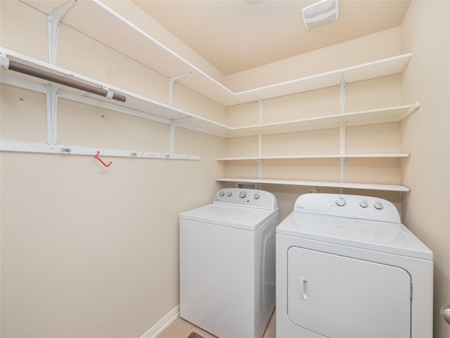 clothes washing area featuring washing machine and clothes dryer