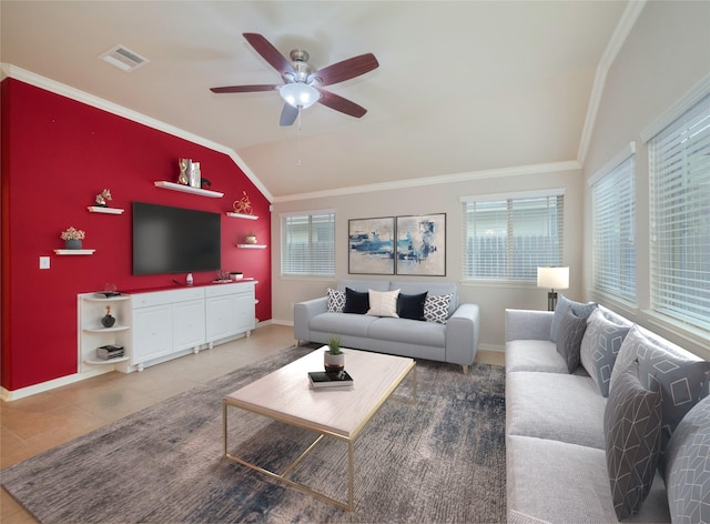 tiled living room featuring crown molding, lofted ceiling, and ceiling fan