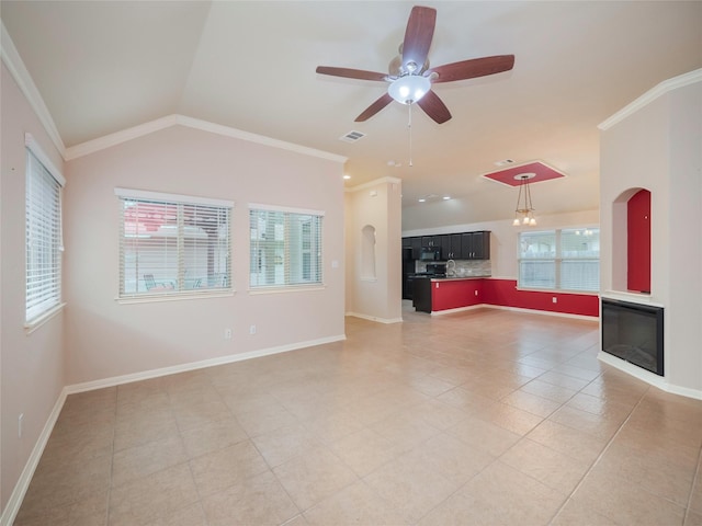 unfurnished living room with ceiling fan, tile patterned flooring, ornamental molding, and vaulted ceiling