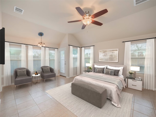 tiled bedroom with vaulted ceiling and ceiling fan