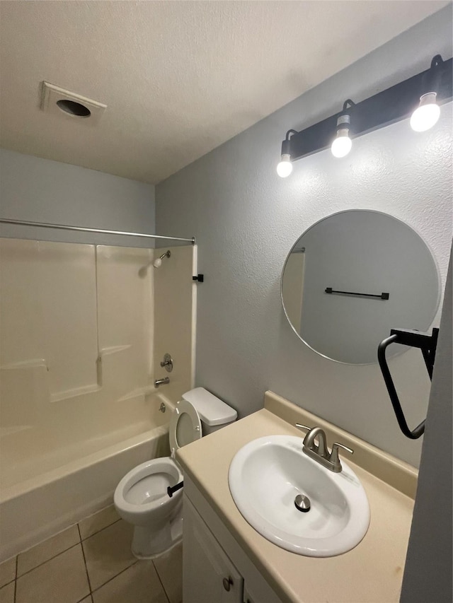 full bathroom featuring a textured ceiling, tile patterned flooring, vanity, shower / bath combination, and toilet