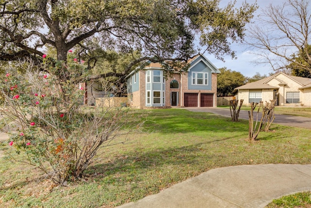 view of front of home featuring a garage and a front lawn