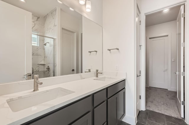 bathroom featuring walk in shower, tile patterned floors, and vanity