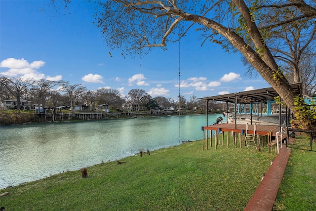 view of dock featuring a water view and a lawn