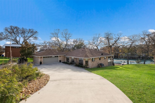 150 Turtle Ln, Seguin, TX 78155 - ranch-style home featuring a garage, concrete driveway, and brick siding