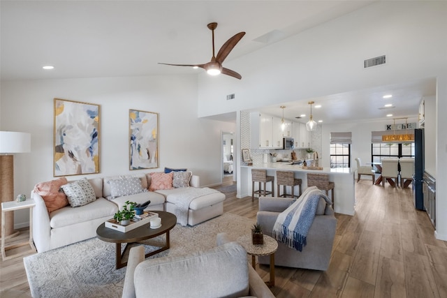 150 Turtle Ln, Seguin, TX 78155 - living area featuring high vaulted ceiling, light wood-style flooring, a ceiling fan, recessed lighting, and baseboards