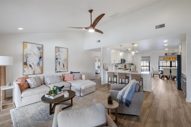 150 Turtle Ln, Seguin, TX 78155 - living area with high vaulted ceiling, light wood-style floors, a ceiling fan, and recessed lighting