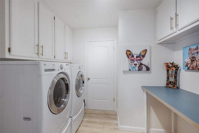 150 Turtle Ln, Seguin, TX 78155 - laundry room featuring washing machine and dryer, cabinet space, and light wood-style flooring