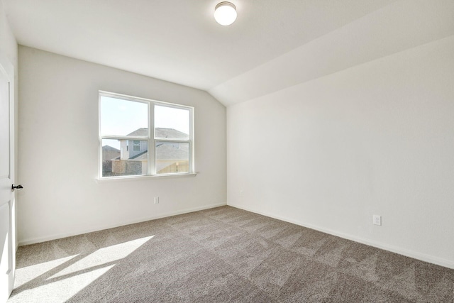 bonus room featuring vaulted ceiling and carpet flooring