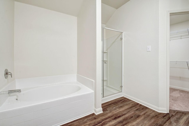 bathroom with separate shower and tub and hardwood / wood-style flooring