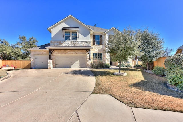 view of front facade with a garage and a front yard