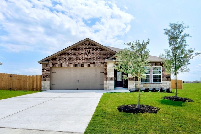 view of front of home with a garage and a front yard