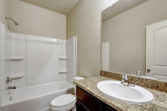 full bathroom featuring toilet, vanity, and  shower combination