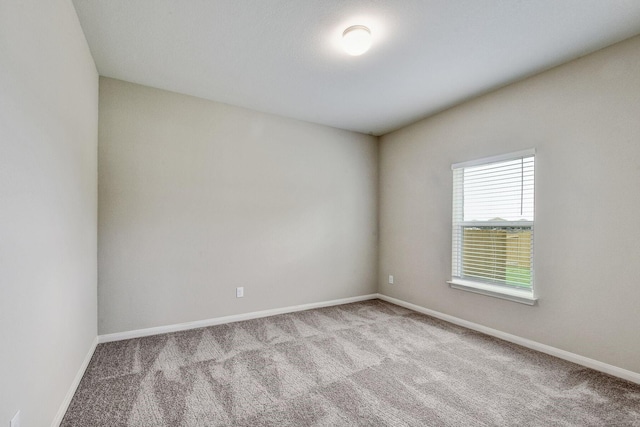 spare room with light colored carpet