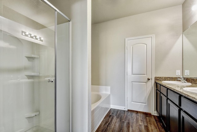 bathroom featuring vanity, shower with separate bathtub, and hardwood / wood-style floors