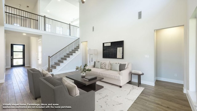 117 White Creek Ln, Georgetown, TX 78628 - living room with a towering ceiling, wood finished floors, and stairs