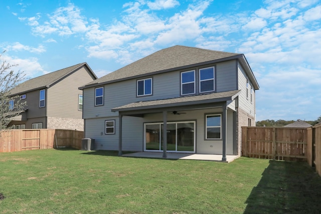 back of house featuring central air condition unit, a lawn, ceiling fan, and a patio