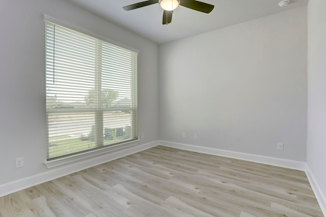 spare room with ceiling fan, light hardwood / wood-style floors, and plenty of natural light