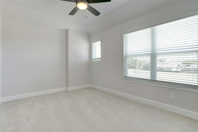 unfurnished room featuring light carpet and ceiling fan