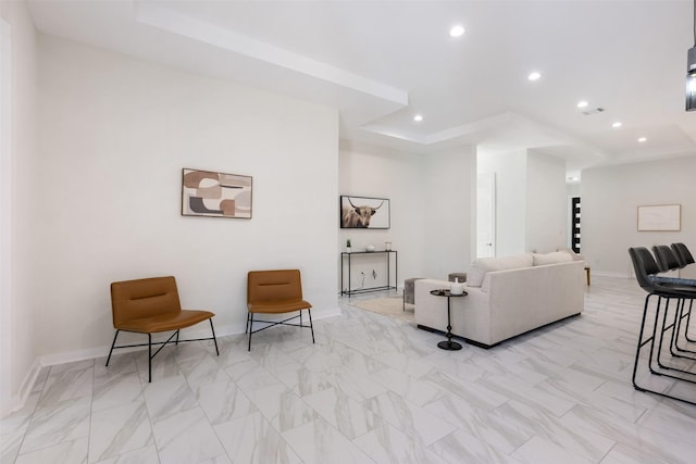 living room with a tray ceiling