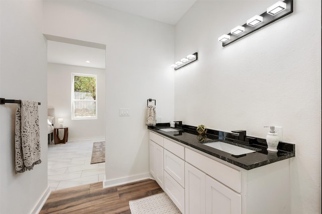 bathroom featuring wood-type flooring and vanity