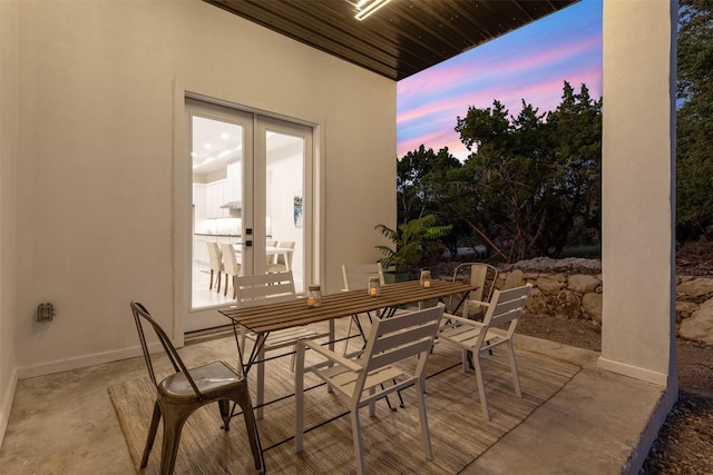 patio terrace at dusk with french doors