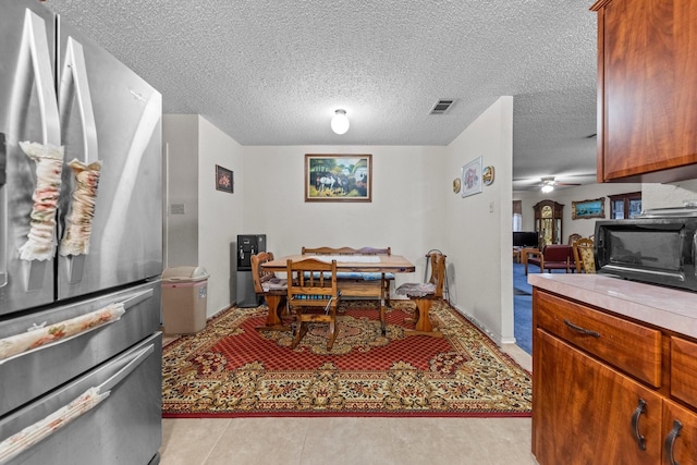 dining area with a textured ceiling