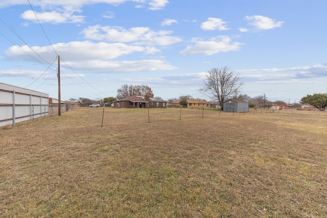 view of yard with a storage unit