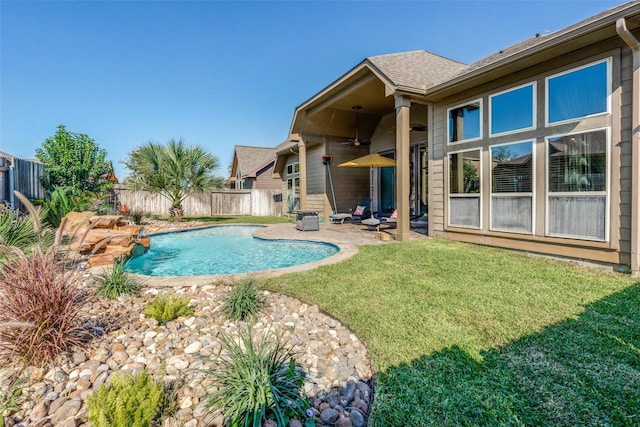 view of pool featuring a patio area and a yard