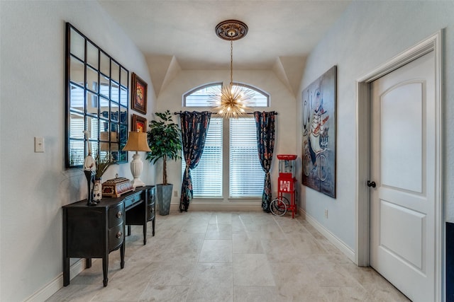 foyer with a notable chandelier