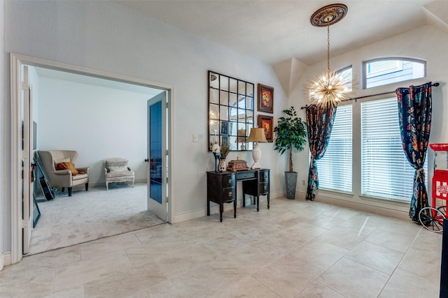 interior space with an inviting chandelier and a healthy amount of sunlight