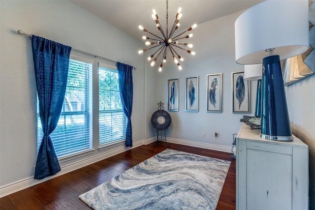 interior space featuring dark hardwood / wood-style floors and a chandelier