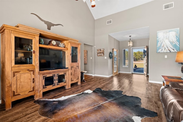 living room with high vaulted ceiling, dark wood-type flooring, and ceiling fan