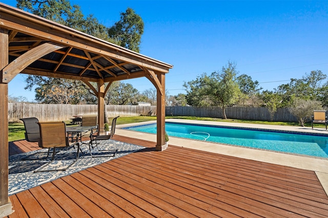 view of swimming pool featuring a deck