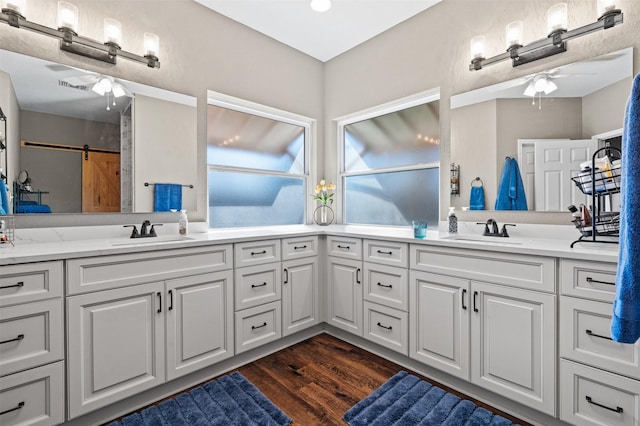 bathroom with vanity, wood-type flooring, and ceiling fan