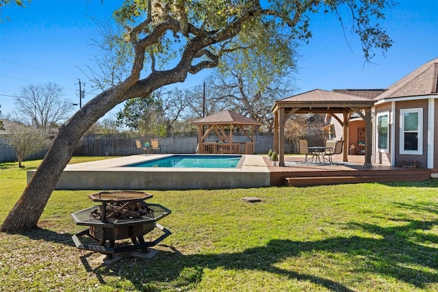 1536 Kings Ranch Rd, Bandera, TX 78003 - view of swimming pool with a gazebo, an outdoor fire pit, and a deck