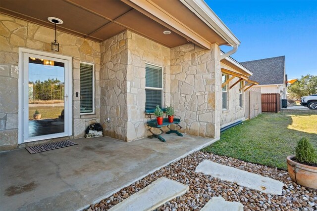 property entrance with a patio