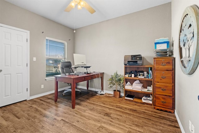 1536 Kings Ranch Rd, Bandera, TX 78003 - office area featuring wood finished floors, a ceiling fan, and baseboards