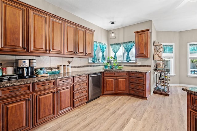 1536 Kings Ranch Rd, Bandera, TX 78003 - kitchen featuring dishwasher, brown cabinets, and light wood-type flooring