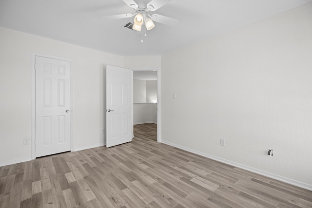 unfurnished bedroom with ceiling fan and light hardwood / wood-style flooring