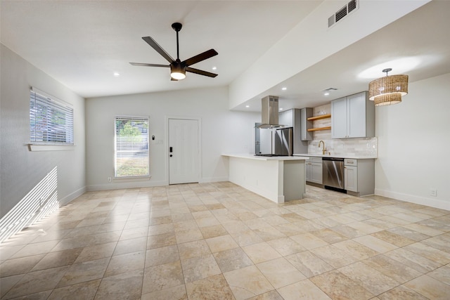 kitchen with island range hood, kitchen peninsula, gray cabinets, stainless steel appliances, and pendant lighting