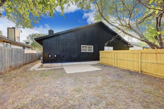 back of property with a patio area