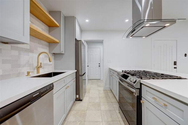 kitchen with white cabinets, sink, appliances with stainless steel finishes, and island range hood