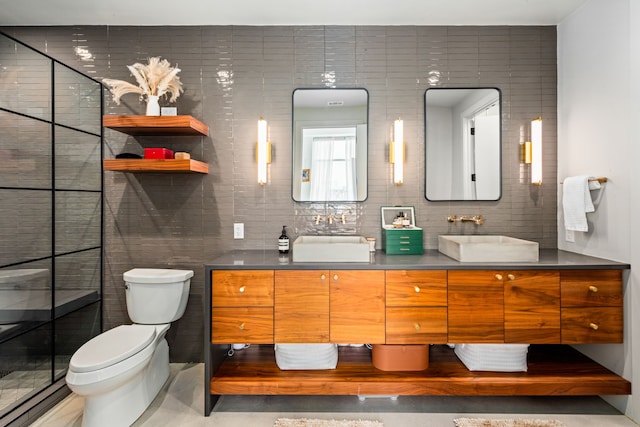 bathroom featuring backsplash, tile walls, toilet, and vanity